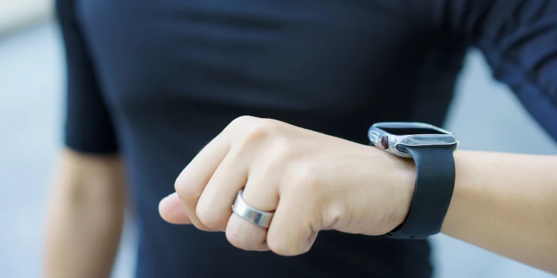 Male athlete looking at watch