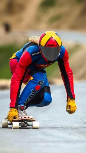 Downhill skateboarding athlete who uses Battle Balm sports medicine pain relief cream for aches and pains from long distance riding.