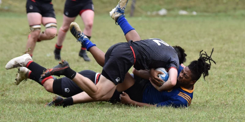 Rugby player hitting the ground with pain